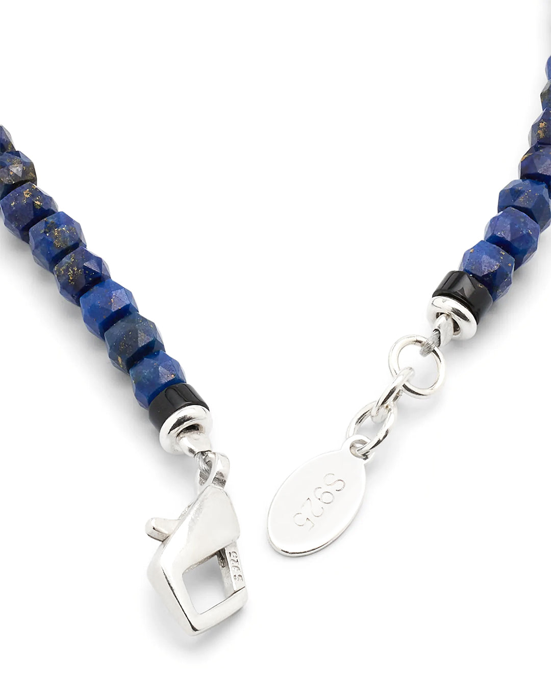 Close up of the sterling silver lobster claw closure on Jan Leslie's Lapis Bead Bracelet with Wood and Sterling Silver Spacers and Lobster Closure.