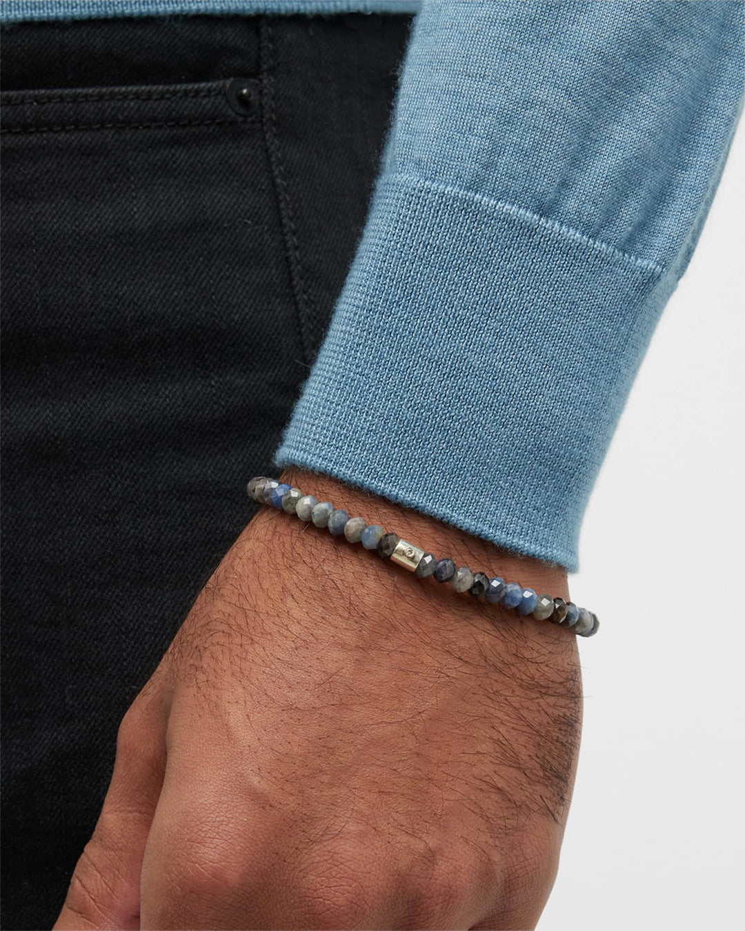 Close up of male models wrist wearing Jan Leslie's Sapphire Bead Bracelet with Diamond Accent Silver Tube.