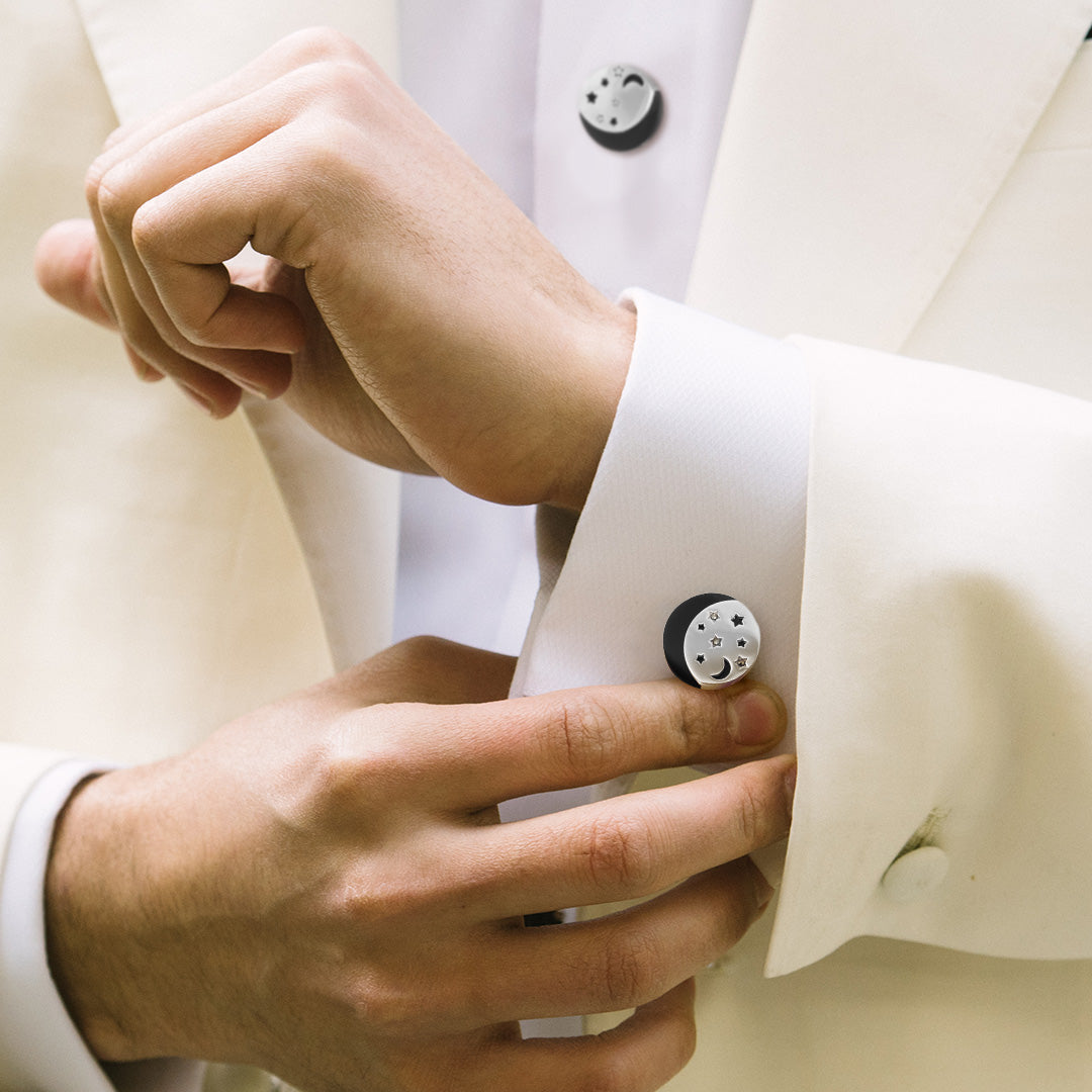 Close up of male models wrist wearing the Starry Night Sterling Silver Cufflinks and Tuxedo Studs on a white tuxedo shirt and off white tuxedo jacket.