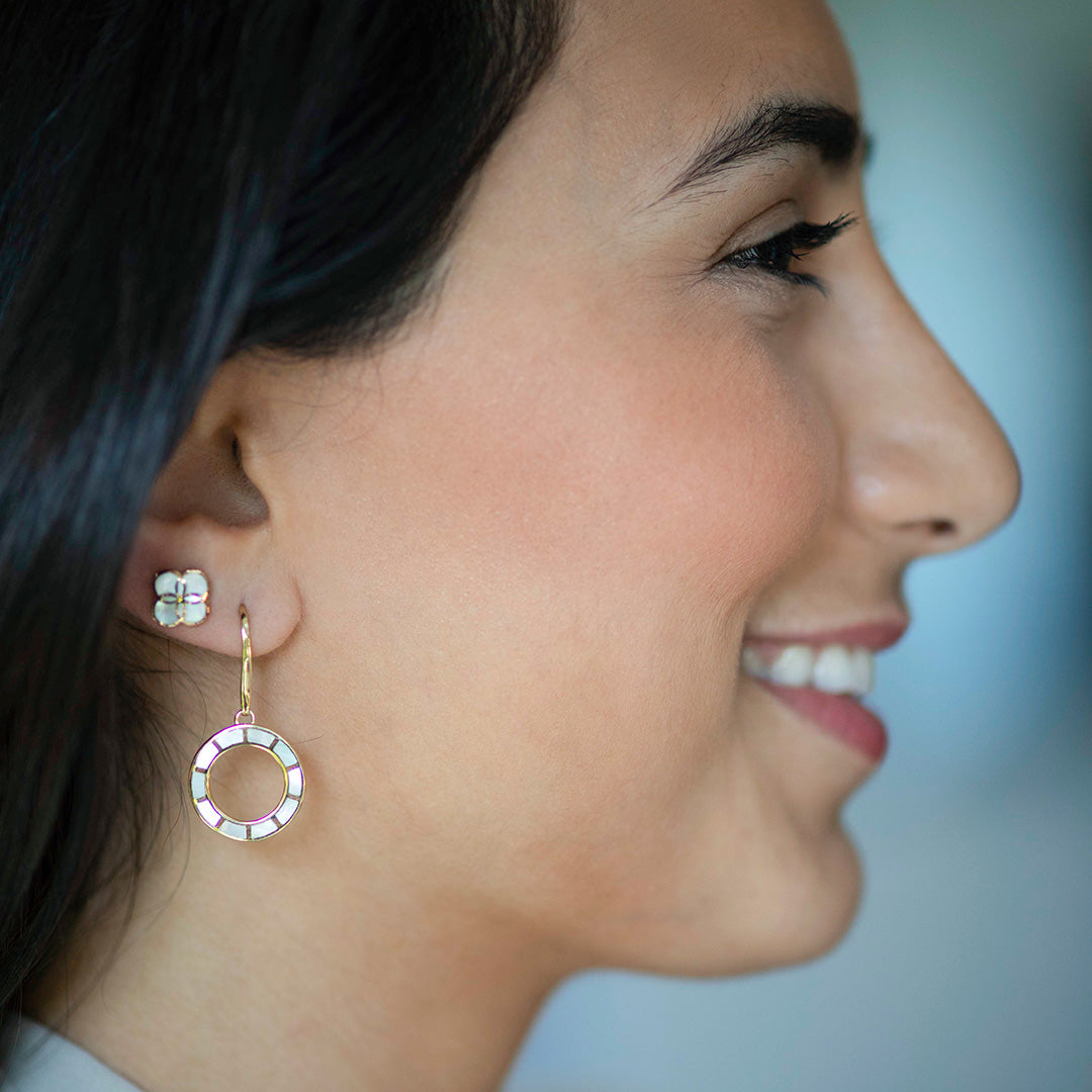 Smiling model wearing Dash Loop Dangle Gemstone 18K Gold Vermeil Sterling Silver Earrings and Koi Cascade Gemstone Inlay Petal Stud Sterling Silver Earrings.