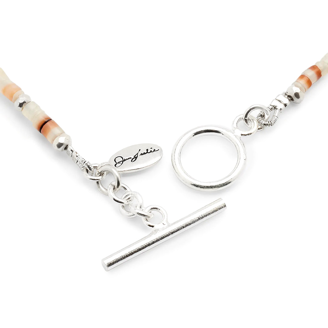 Close up photo of the sterling silver toggle closure on the Freshwater Pearl Center White Shell Beaded Necklace with Sterling Silver Accents.