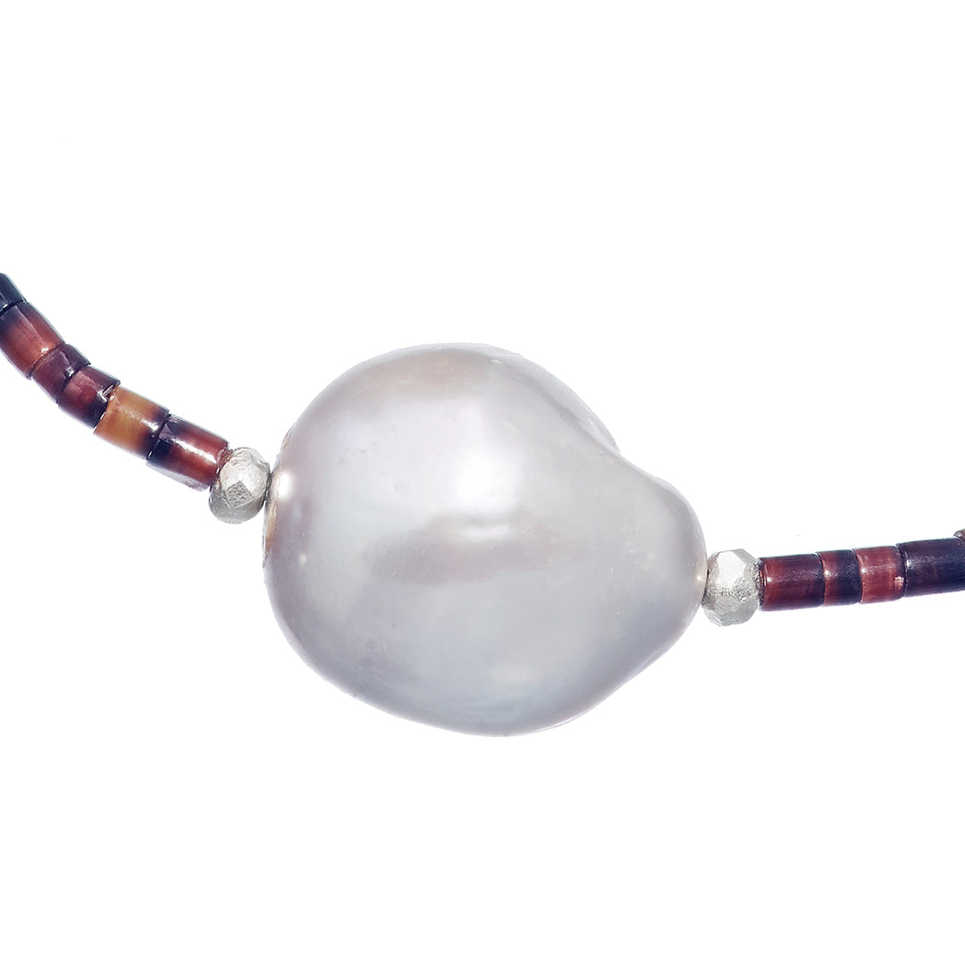 Close up of the Freshwater pearl on the Freshwater Pearl Center Chocolate Shell Beaded Necklace with Sterling Silver Accents.