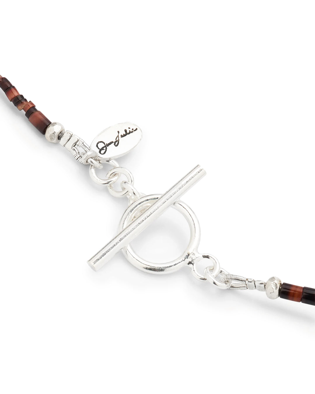 Close up of the toggle closure on the Freshwater Pearl Center Chocolate Shell Beaded Necklace with Sterling Silver Accents.