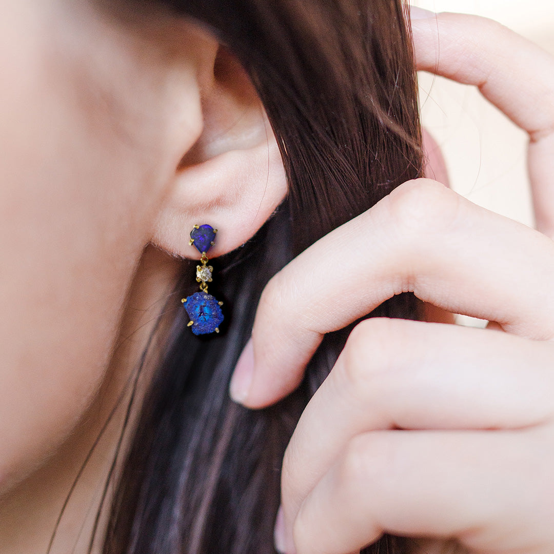 Female model wearing Bora Bora 18K Gold One of a Kind Gemstone Earrings. Jan Leslie Bespoke Earrings.