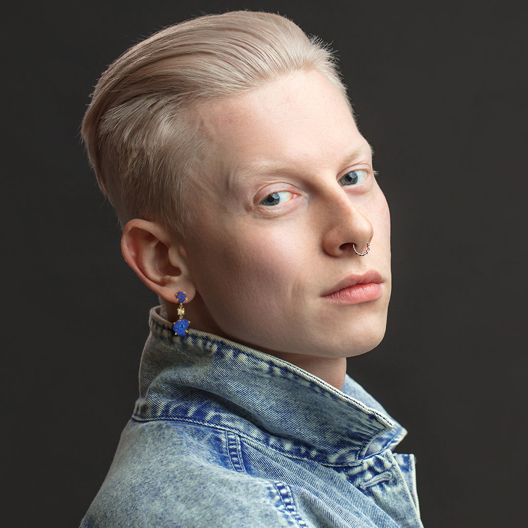 Side profile of male model wearing Bora Bora 18K Gold One of a Kind Gemstone Earrings. Jan Leslie Bespoke Earrings.