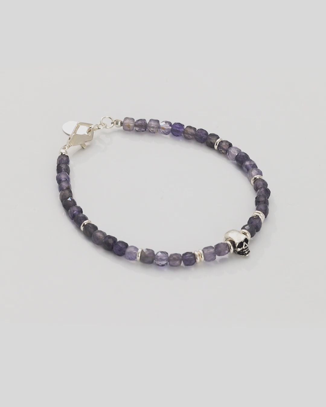 Video of 360 degree view of the Faceted Rutilated Quartz Gemstone Beaded Bracelet with Sterling Silver Skull.