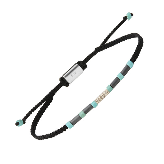 Adjustable black braided cord bracelet with hematite and turquoise tube beads, a sterling silver spiral charm centerpiece, and a 925 hallmarked sliding clasp.