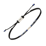 Adjustable black braided cord bracelet with hematite and lapis lazuli tube beads, a sterling silver spiral charm centerpiece, and a 925 hallmarked sliding clasp.