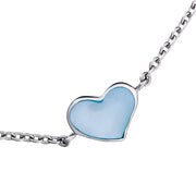 Close-up of blue mother-of-pearl bezel heart station sterling silver bracelet — Jan Leslie