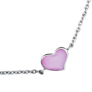 Close-up of pink mother-of-pearl bezel heart station sterling silver bracelet — Jan Leslie