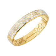 : 18K gold vermeil white mother-of-pearl petal Seed of Life hinged cuff bangle angled view showing chamfered polished gold edge frame recessed luminous white iridescent MOP inset panel with continuous Seed of Life gold lattice and laser-engraved Jan Leslie signature on inner barrel by Jan Leslie