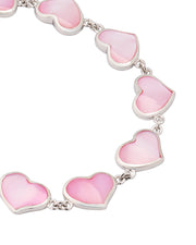 Close-up of pink mother-of-pearl heart link sterling silver bracelet — Jan Leslie