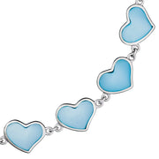 Close-up of blue mother-of-pearl heart link sterling silver bracelet — Jan Leslie