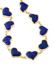 Blue lapis bezel heart link gold bracelet draped, angled studio view — Jan Leslie