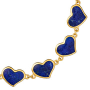 Close-up of blue lapis bezel heart links on gold chain bracelet — Jan Leslie