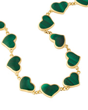 Close-up of green malachite bezel heart links on gold chain bracelet — Jan Leslie