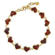 Detail view of red tiger's eye bezel heart link gold bracelet — Jan Leslie