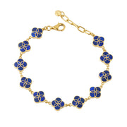 gold vermeil sterling silver multi-station lapis lazuli floral lattice quatrefoil bracelet with deep royal blue stone inlay petal stations, rolo chain links, lobster clasp, and paperclip extender chain with JL disc charm, Jan Leslie