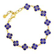 18K gold vermeil lapis lazuli petal Seed of Life station bracelet lifestyle flat view showing continuous deep royal blue lapis lazuli quatrefoil stations with Seed of Life gold lattice and Jan Leslie disc tag by Jan Leslie