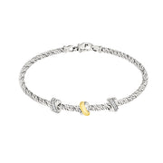 Braided sterling silver bracelet with pavé white topaz rondelle stations and a gold vermeil accent bead.