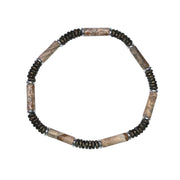 Men's stretch bracelet with tan picture jasper tube beads, dark hematite disc heishi beads, and silver accent rings.