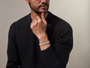 Men's white howlite bead stretch bracelet with sterling silver engraved rondelle spacer and Jan Leslie