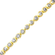 Close-up of round CZ bezel-set gold tennis bracelet showing stone and setting detail — Jan Leslie