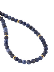 Blue sapphire faceted round bead bracelet angled view showing deep midnight blue faceted sapphire beads and gold vermeil rondelle spacer detail by Jan Leslie