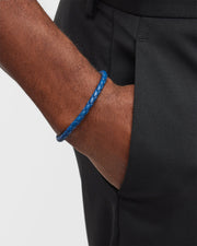 Royal blue braided leather bracelet with magnetic clasp worn on man's wrist
