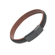 Close-up of gunmetal magnetic clasp on brown leather flat cuff bracelet with black braided edge detail, luxury men's leather jewelry.