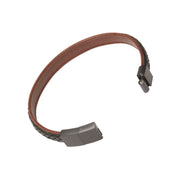 Interior view of brown leather flat cuff bracelet showing smooth lining and open gunmetal magnetic snap clasp ends, luxury men's leather jewelry.