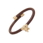 Handcrafted black leather wrap bracelet anchored by a sculptural gold-plated elephant head.