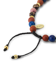 Close-up of lapis lazuli, red jasper, rhodonite, and leopard jasper beads with gold heishi spacers, Jan Leslie