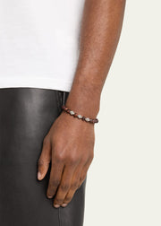 Red tiger's eye beaded flex bracelet with oxidized sterling silver scroll beads worn on wrist