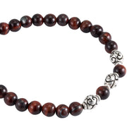 Red tiger's eye beaded flex bracelet with oxidized sterling silver scroll beads close-up