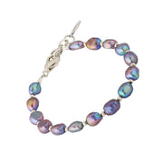 Iridescent gray freshwater baroque pearl bracelet with silver beads and lobster clasp.