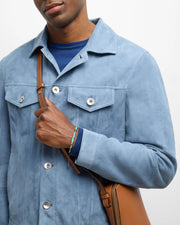 Men's turquoise heishi bead bracelet with antique brass spacers worn with blue suede jacket and leather bag, Jan Leslie