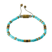 Turquoise heishi bead bracelet with antique brass and black onyx spacers on adjustable cord, Jan Leslie