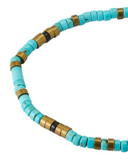 Close-up of engraved antique brass sliding clasp on turquoise heishi bead bracelet, Jan Leslie