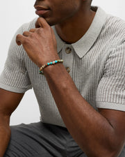 Men's turquoise and imperial jasper stretch bracelet with sterling silver skull centerpiece.