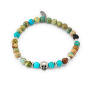 Men's turquoise and imperial jasper stretch bracelet with sterling silver skull centerpiece and hex spacers. Shop Jan Leslie.