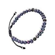 Men's dark freshwater pearl bracelet with matte grey agate accents and sterling silver rondelles on adjustable braided cord. Jan Leslie.