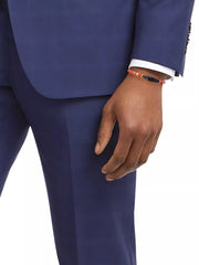 Men's coral red glass bead bracelet with Tibetan dzi agate charm styled with navy suit and white dress shirt, Jan Leslie