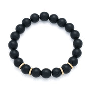 Matte black onyx round bead stretch bracelet with gold textured ring spacers.