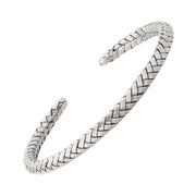 Oxidized sterling silver herringbone woven open cuff bracelet with antiqued finish.