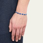 Linked bracelet with eleven rectangle lapis lazuli cabochon tiles in deep royal blue with gold pyrite flecks 