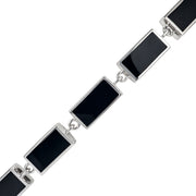 Sterling silver black onyx rectangular station tennis bracelet close-up showing deep jet black mirror-polished onyx in polished silver chamfered bezels with direct jump ring connections by Jan Leslie