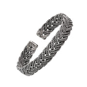 Oxidized sterling silver wide multi-strand Balinese foxtail woven cuff bracelet full silhouette showing interlaced braid pattern and squared open ends by Jan Leslie