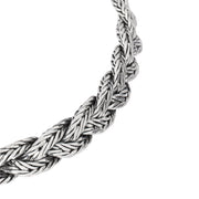 Oxidized sterling silver double-strand Balinese foxtail chain bracelet angled view showing hand-woven chain texture engraved barrel caps and hook clasp detail by Jan Leslie