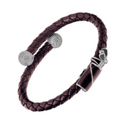 "Black double-strand braided leather bypass cuff bracelet with two pavé crystal golf ball end caps and black enamel golf bag clasp with silver golf club detail